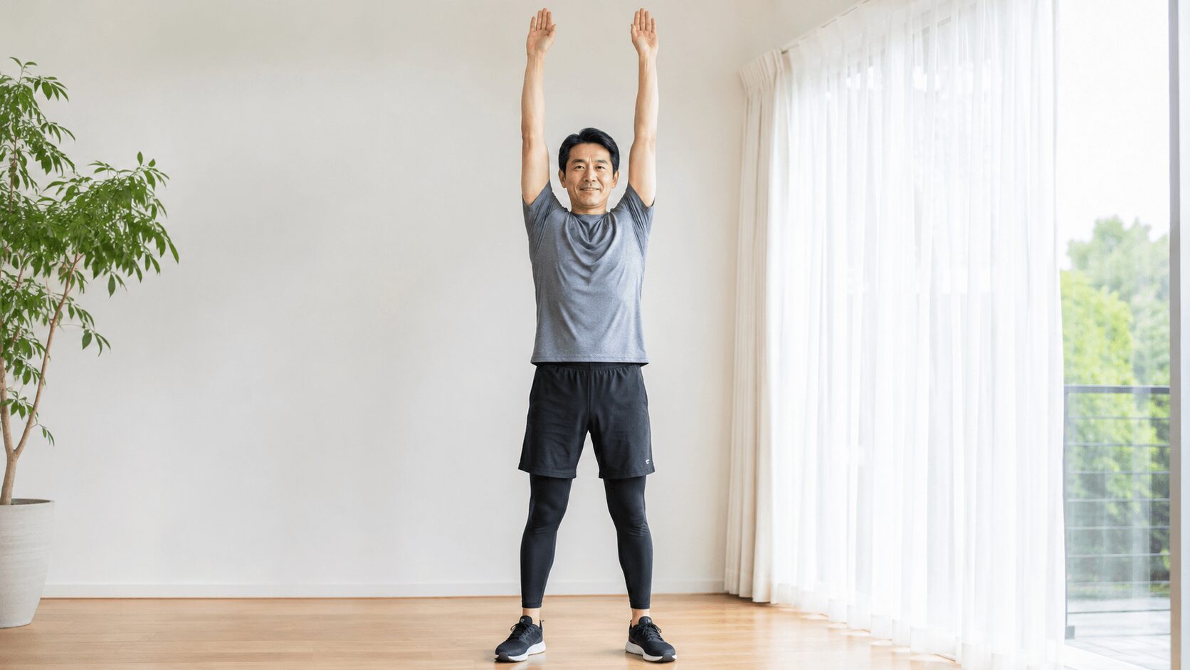 筋トレ前にウォームアップのストレッチをする40代男性